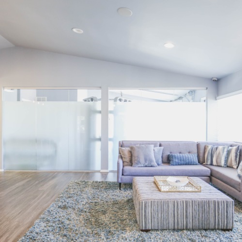 Relax in our resident clubhouse with wifi Large room with furniture and kitchen island